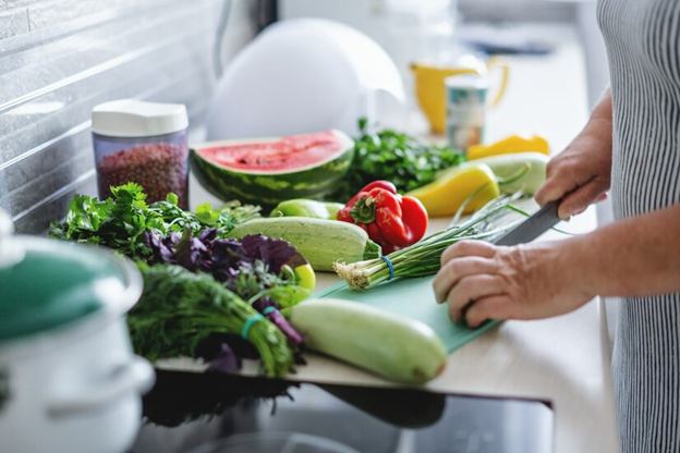 A person cutting vegetables